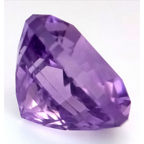 850 - A 7ct Bolivian Amethyst Gemstone. Trillion shape. Comes with a GFCO Swiss authenticity card.