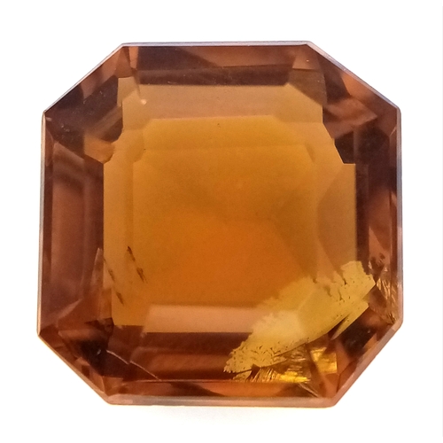 878 - A 4.91ct Madeira Citrine Gemstone. Octagon shape. Comes with GFCO Swiss authenticity card.