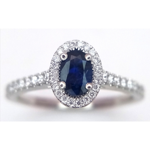 123 - A PLATINUM DIAMOND & SAPPHIRE HALO RING 4.5G TOTAL WEIGHT, SIZE M. Ref: 9118