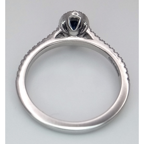 123 - A PLATINUM DIAMOND & SAPPHIRE HALO RING 4.5G TOTAL WEIGHT, SIZE M. Ref: 9118