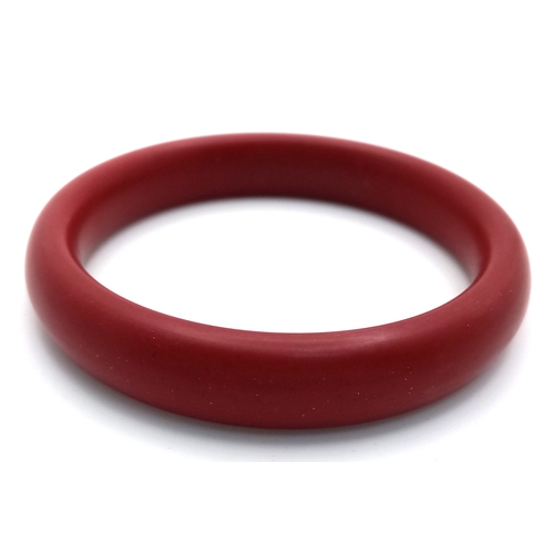 1445 - A Red Cinnabar Bangle. 8mm width. 60mm inner diameter.