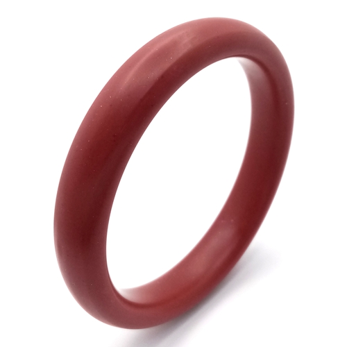 1445 - A Red Cinnabar Bangle. 8mm width. 60mm inner diameter.