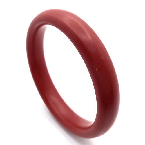 1445 - A Red Cinnabar Bangle. 8mm width. 60mm inner diameter.