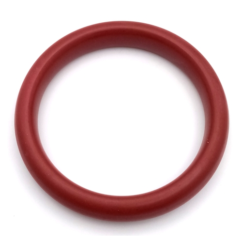 1445 - A Red Cinnabar Bangle. 8mm width. 60mm inner diameter.