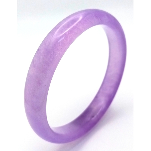 889 - A Lavender Jadeite Bangle. 8mm width. 58mm inner diameter.