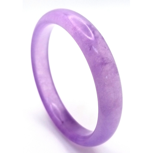 889 - A Lavender Jadeite Bangle. 8mm width. 58mm inner diameter.