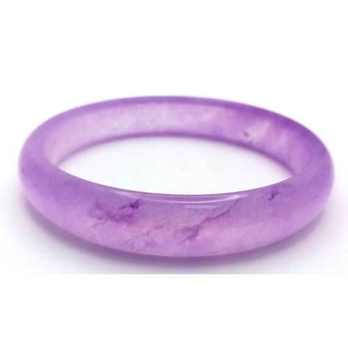 889 - A Lavender Jadeite Bangle. 8mm width. 58mm inner diameter.