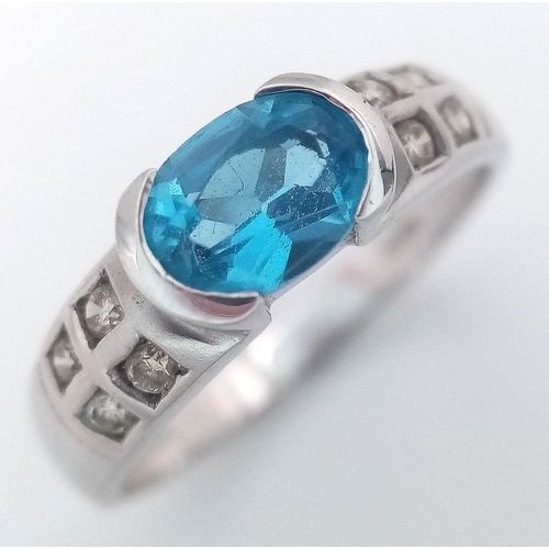 1308 - A 9K WHITE GOLD DIAMOND & LONDON BLUE TOPAZ RING 2.4G TOTAL WEIGHT, SIZE M. Ref: SC 2003