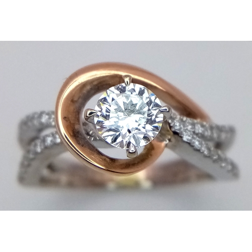 16 - An 18K White and Yellow Gold Diamond GIA Certified Ring. A central 0.52ct brilliant round cut diamon... 