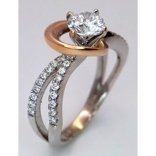 16 - An 18K White and Yellow Gold Diamond GIA Certified Ring. A central 0.52ct brilliant round cut diamon... 