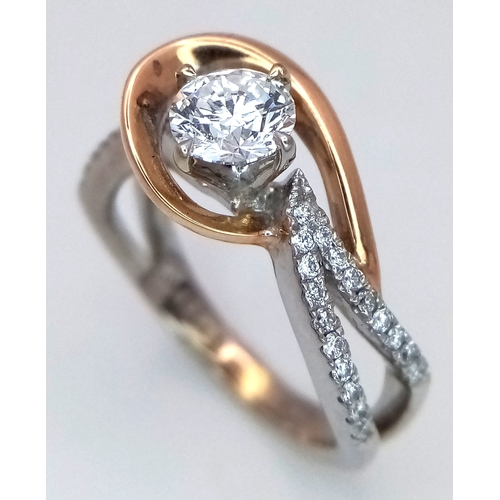 16 - An 18K White and Yellow Gold Diamond GIA Certified Ring. A central 0.52ct brilliant round cut diamon... 