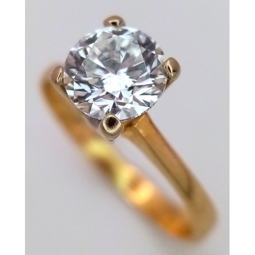 65 - A WGI Certified 18K Yellow Gold and Diamond Solitaire Ring. A 1.02ct brilliant round cut diamond. SI... 