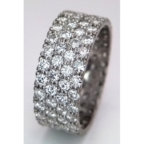 515 - A WGI Certified 14K White Gold (tested) Diamond Eternity Ring. Four rows set with 112 brilliant roun... 