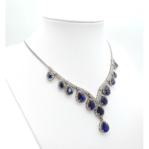 337 - A Blue Sapphire and Diamond Necklace. Set in 925 Silver. Pear shaped sapphires -20ctw approx with Di... 