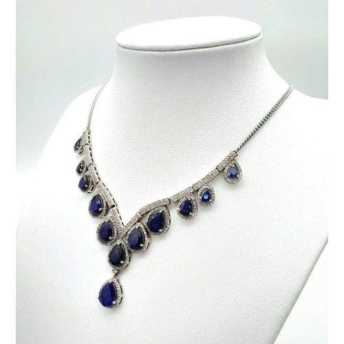 337 - A Blue Sapphire and Diamond Necklace. Set in 925 Silver. Pear shaped sapphires -20ctw approx with Di... 