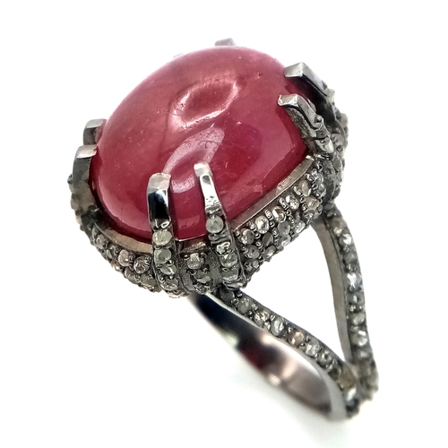 499 - A 20ct Ruby Cabochon Ring with 2ctw of Diamond Accents. Set in 925 Silver. Size N. CD-1675