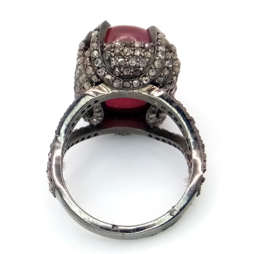 499 - A 20ct Ruby Cabochon Ring with 2ctw of Diamond Accents. Set in 925 Silver. Size N. CD-1675