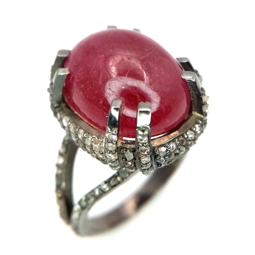 499 - A 20ct Ruby Cabochon Ring with 2ctw of Diamond Accents. Set in 925 Silver. Size N. CD-1675