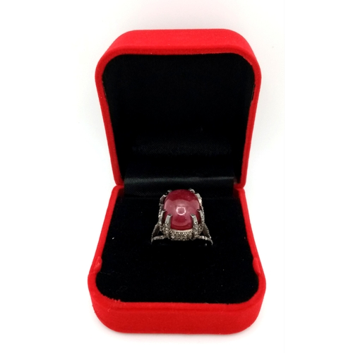 499 - A 20ct Ruby Cabochon Ring with 2ctw of Diamond Accents. Set in 925 Silver. Size N. CD-1675