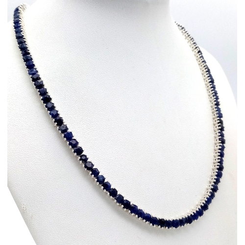 527 - A Blue Sapphire Gemstone Tennis Necklace. Set in 925 Silver.
44cm. CD-1670.