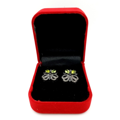 561 - A Pair of Peridot and Sapphire Stud Earrings with Diamond Accents. Set in 925 Silver. CD-1676.