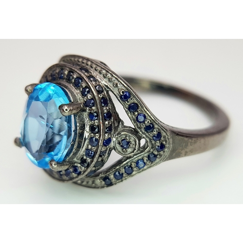 624 - A 2.5ct Blue Topaz Gemstone Ring with Diamond Accents. Set in 925 silver. Size O 1/2. CD-1684