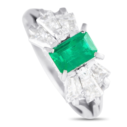 994 - A Platinum 1.07ct Diamond and Emerald Ring. The Platinum setting beautifully showcases this pieces r... 