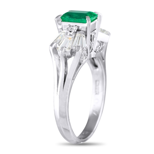 994 - A Platinum 1.07ct Diamond and Emerald Ring. The Platinum setting beautifully showcases this pieces r... 