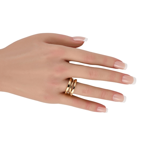 1637 - An Bvlgari B.zero1 18K Rose Gold Ring. An intricate 18K Rose Gold setting. Cut-out accents at the ce... 