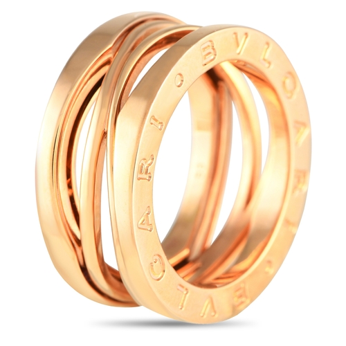 1637 - An Bvlgari B.zero1 18K Rose Gold Ring. An intricate 18K Rose Gold setting. Cut-out accents at the ce... 