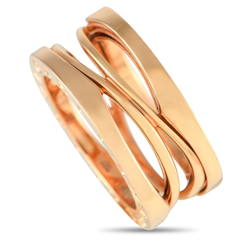 1637 - An Bvlgari B.zero1 18K Rose Gold Ring. An intricate 18K Rose Gold setting. Cut-out accents at the ce... 