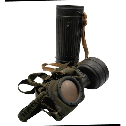 46 - A 1942 Dated German Gas Mask & Canister. Named to an SS Panzer Grenadier inside the lid.