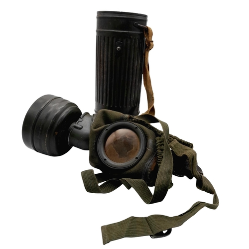 46 - A 1942 Dated German Gas Mask & Canister. Named to an SS Panzer Grenadier inside the lid.