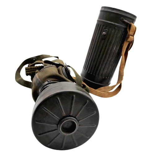 46 - A 1942 Dated German Gas Mask & Canister. Named to an SS Panzer Grenadier inside the lid.