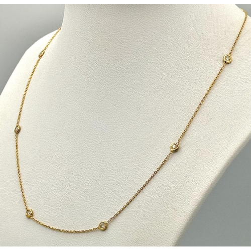 253 - An 18K Yellow Gold Diamond Necklace. 8 round cut set diamonds - .60ctw. 40cm. 2.65g