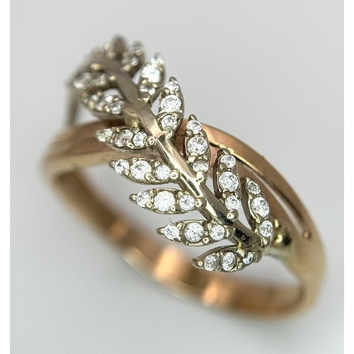 260 - An 18K Yellow Gold Diamond Leaf Form Crossover Ring. Size O 1/2. 3.2g