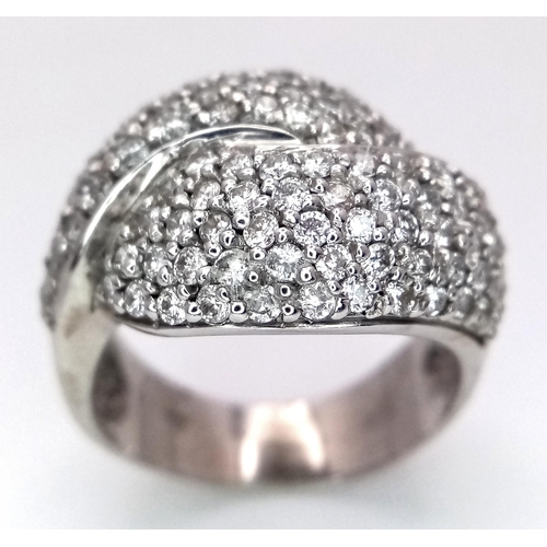 379 - An 18K White Gold Diamond Crossover Pave Ring. Size M. 7.25g total weight.