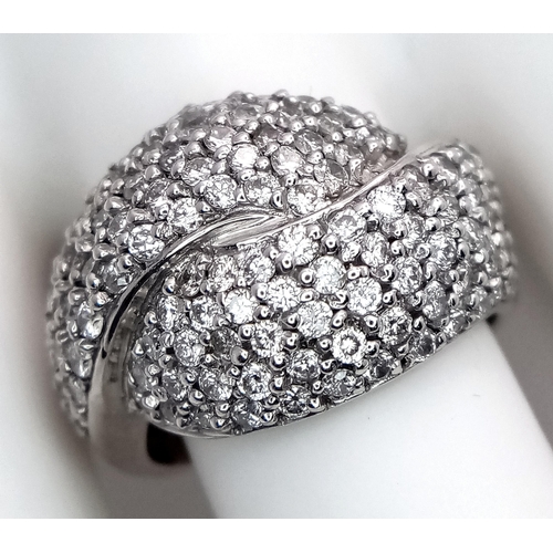 379 - An 18K White Gold Diamond Crossover Pave Ring. Size M. 7.25g total weight.