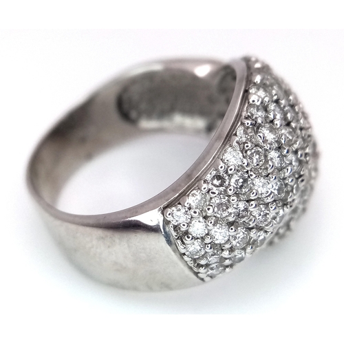 379 - An 18K White Gold Diamond Crossover Pave Ring. Size M. 7.25g total weight.