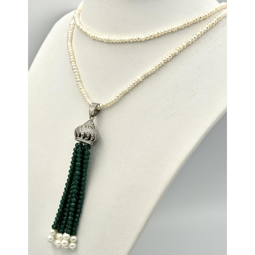 386 - A Cultured Seed Pearl Necklace with Jade Bead Tassel Pendant. Decorative silver attachment. 8cm and ... 