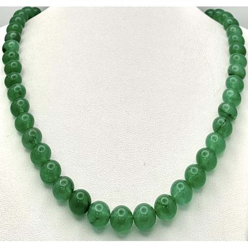 505 - A Jade Beaded Necklace with Silver Clasp. 48cm