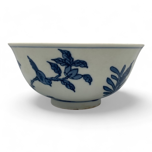 1058 - An antique Chinese Kangxi Blue and White Porcelain Bowl. Hand painted featuring bird and floral moti... 