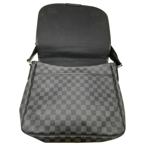 194 - A Louis Vuitton Damier Graphite Damien MM Messenger Bag. Coated canvas exterior with leather trim, s... 