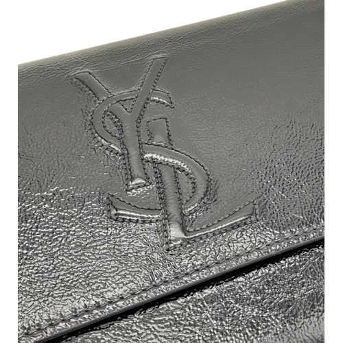 243 - A Saint Laurent Belle De Jour Clutch Bag. Black textured patent leather exterior featuring the class... 