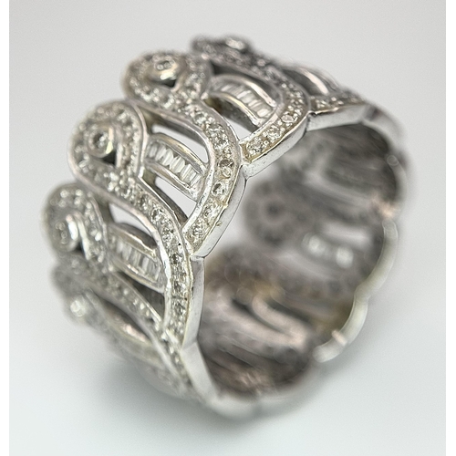 370 - An 18K White Gold and Diamond Crown Band Ring. Regal in nature with round and baguette cut diamonds ... 