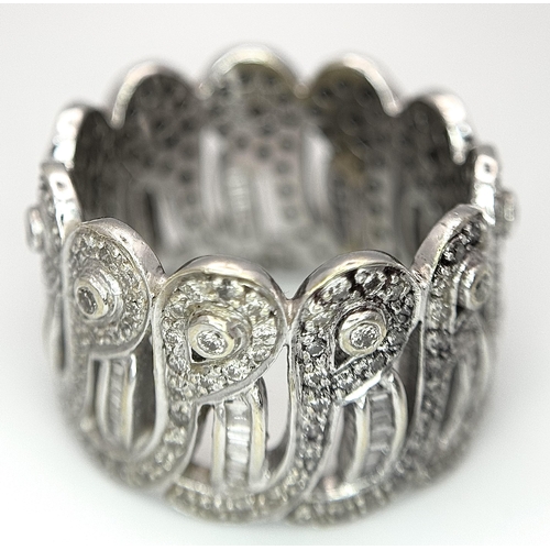 370 - An 18K White Gold and Diamond Crown Band Ring. Regal in nature with round and baguette cut diamonds ... 