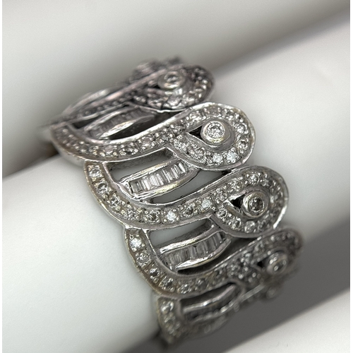 370 - An 18K White Gold and Diamond Crown Band Ring. Regal in nature with round and baguette cut diamonds ... 