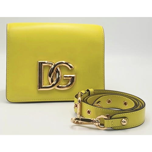 391 - A Dolce & Gabbana Crossbody Bag. Smooth yellow leather exterior with gold-toned hardware, featuring ... 