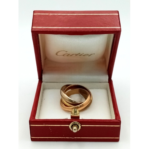 463 - A Cartier 18K Gold Trinity Ring. Yellow, rose and white gold. Size E 1/2. 10.4g. Come with original ... 