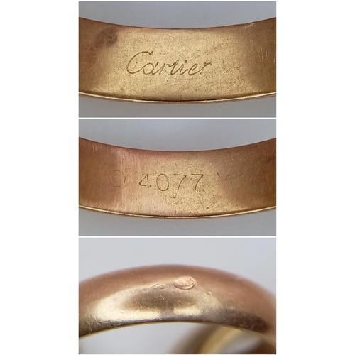 463 - A Cartier 18K Gold Trinity Ring. Yellow, rose and white gold. Size E 1/2. 10.4g. Come with original ... 